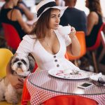 young-lady-bar-with-cute-dog-having-lunch (1)